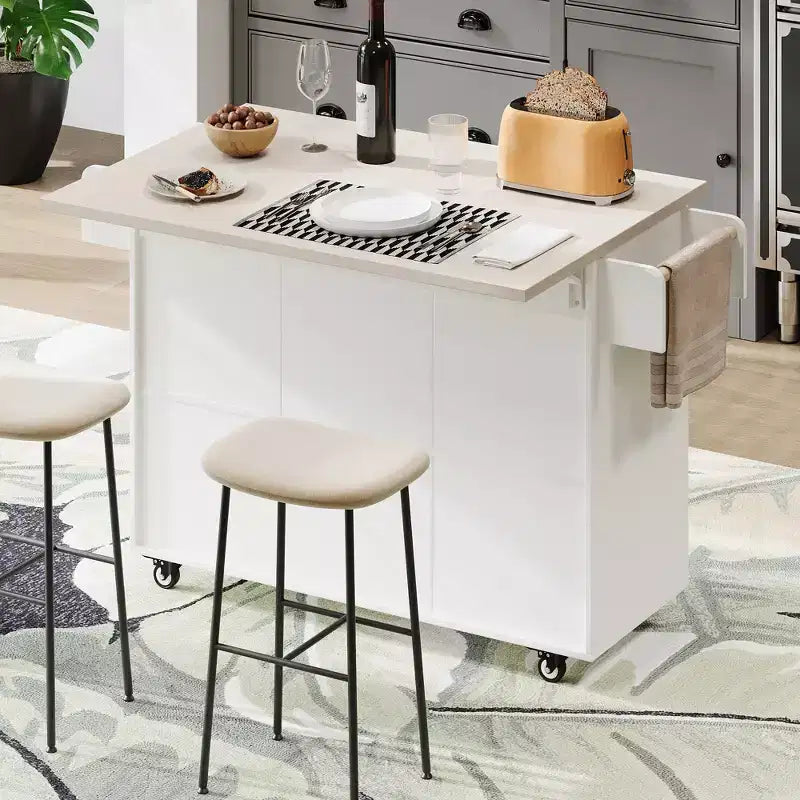 Isla de cocina con armario para guardar el cubo de basura y estante ajustable, carrito de cocina con ruedas y ala abatible, toallero y cajón